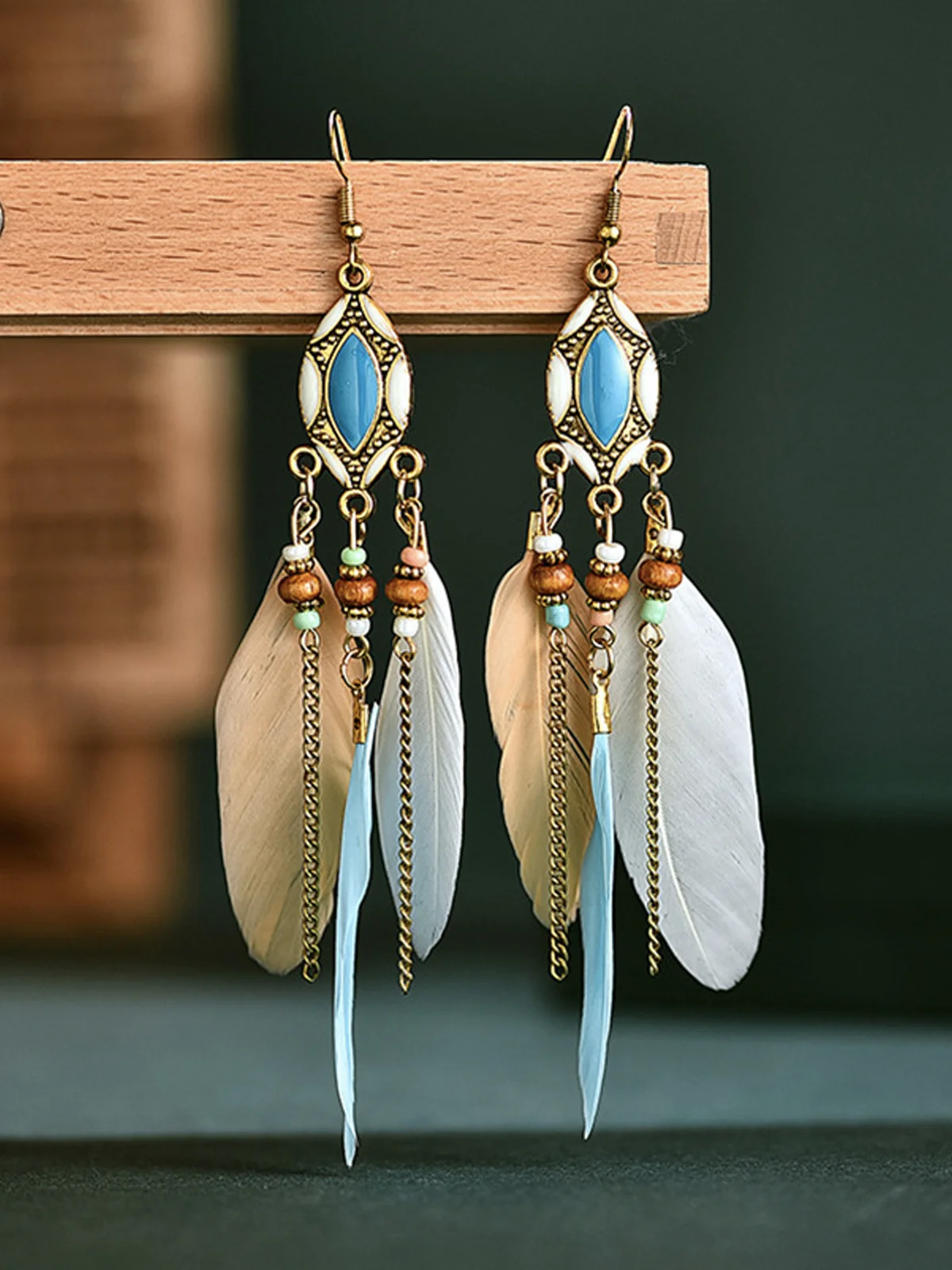 Rice beads retro tassel feather earrings long oil dripping feather earrings European and American Bohemian