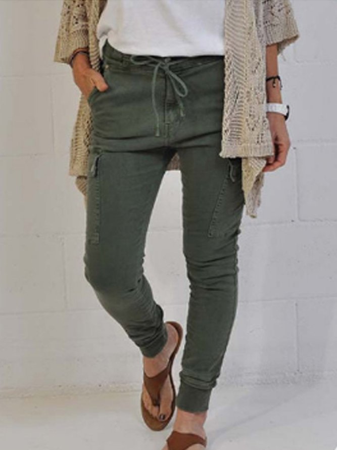 green stacked pants