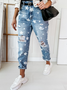 Women's denim trousers with star pattern ripped holes